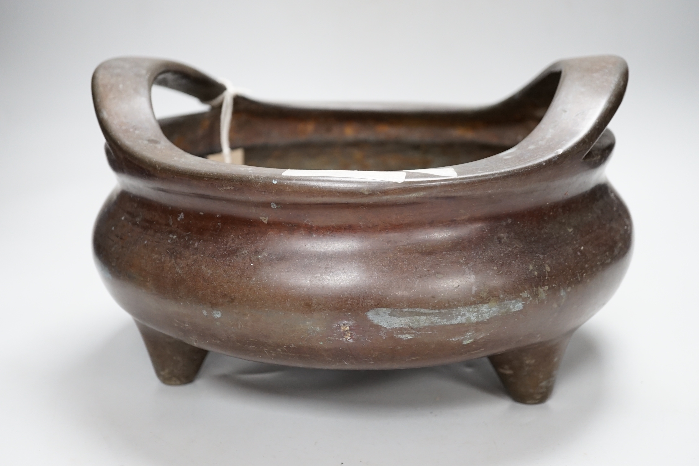 A large Chinese bronze censer, 30cm wide